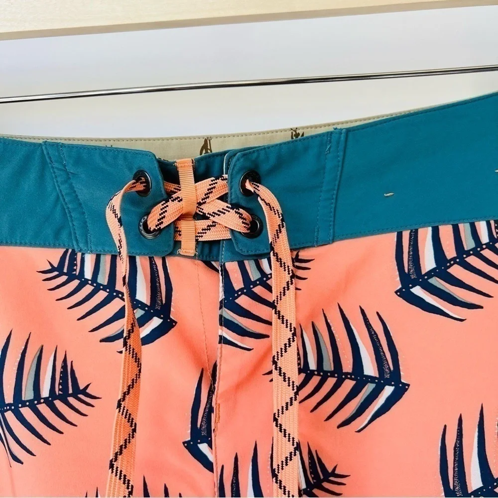 Patagonia Wavefarer boy shorts in coral palm leaves prints